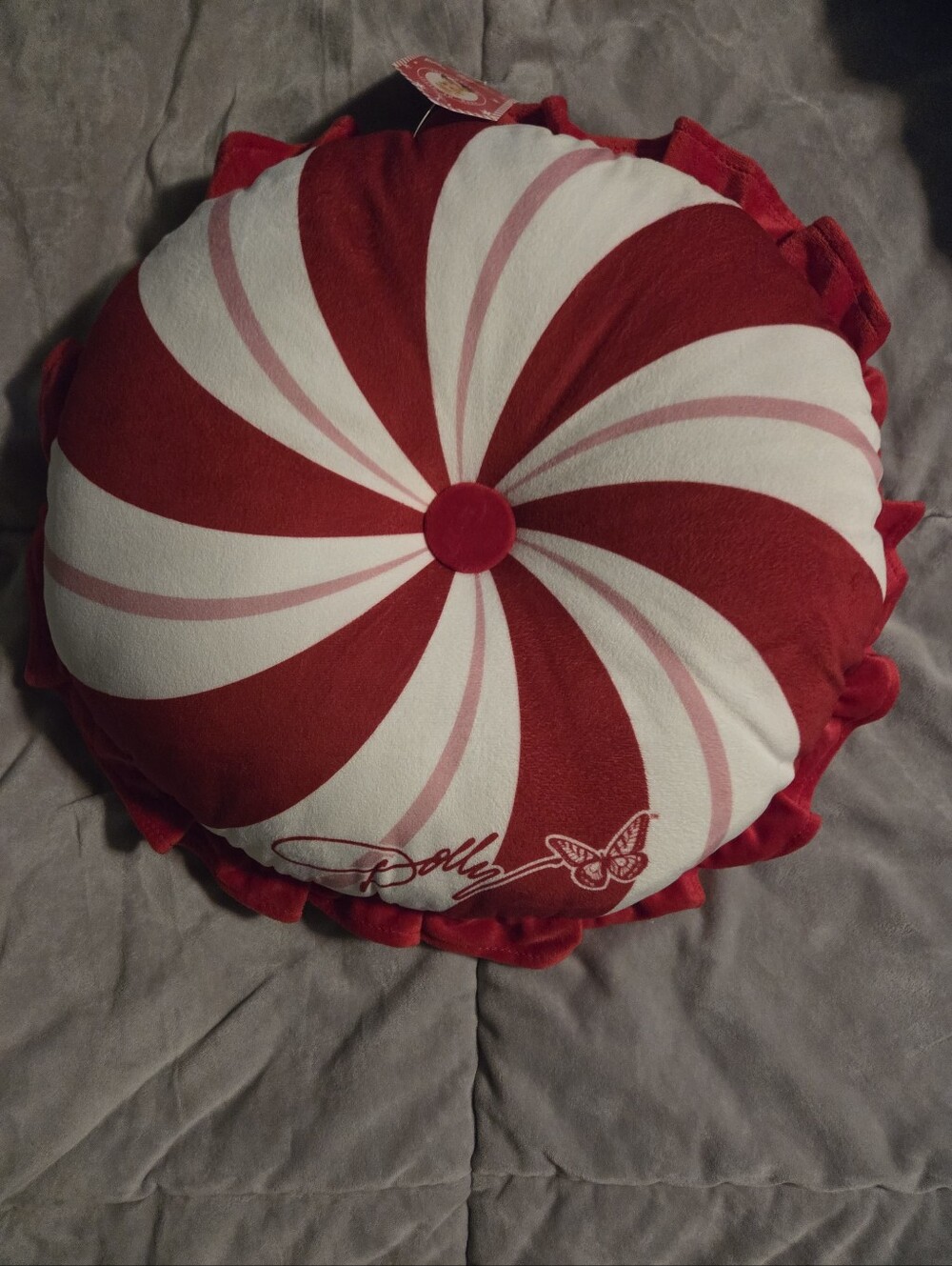 NWT DOLLY PARTON CHRISTMAS PEPPERMINT PILLOW. 15 INCHES ROUND
